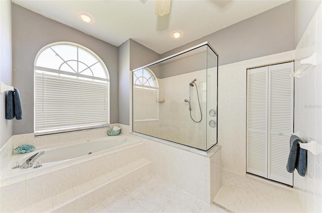 full bathroom featuring tile patterned floors, walk in shower, and a bath