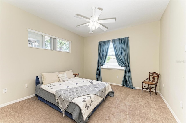 bedroom featuring carpet flooring, baseboards, and multiple windows