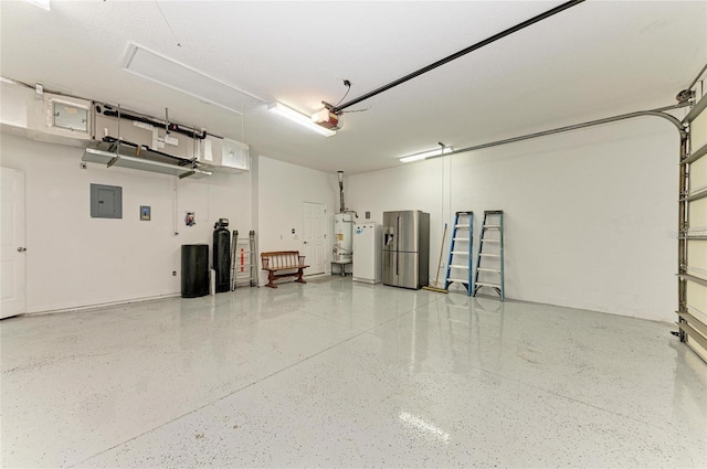 garage featuring white refrigerator with ice dispenser, stainless steel fridge with ice dispenser, gas water heater, a garage door opener, and electric panel