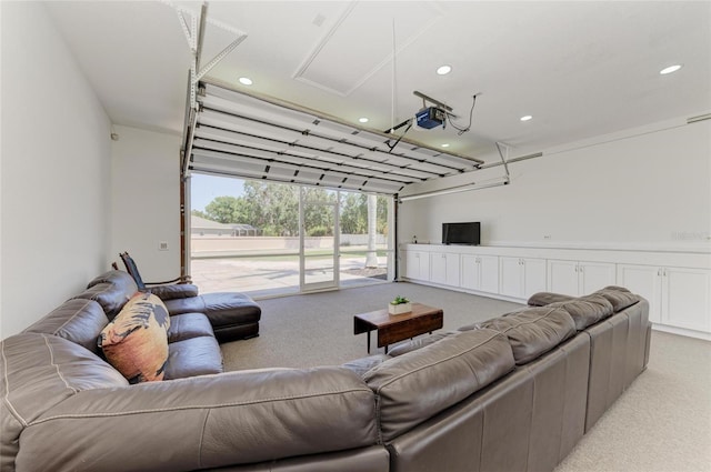 carpeted living area featuring recessed lighting