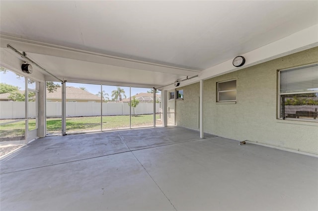 unfurnished sunroom featuring plenty of natural light