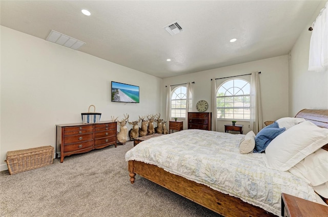 carpeted bedroom featuring recessed lighting and visible vents