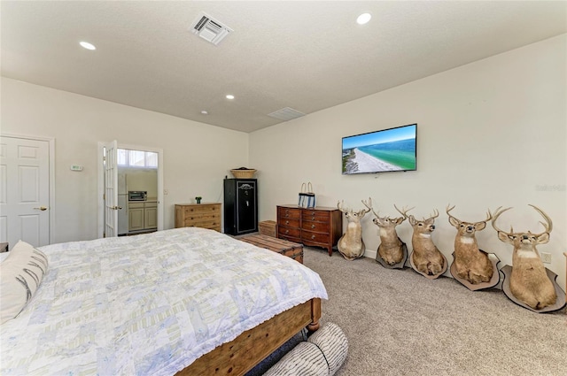 carpeted bedroom with recessed lighting and visible vents