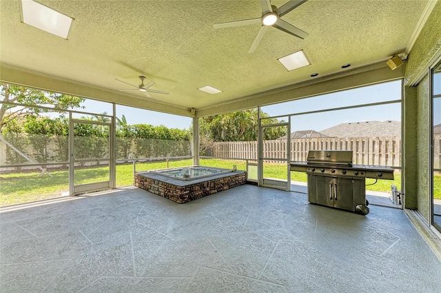 sunroom / solarium with ceiling fan