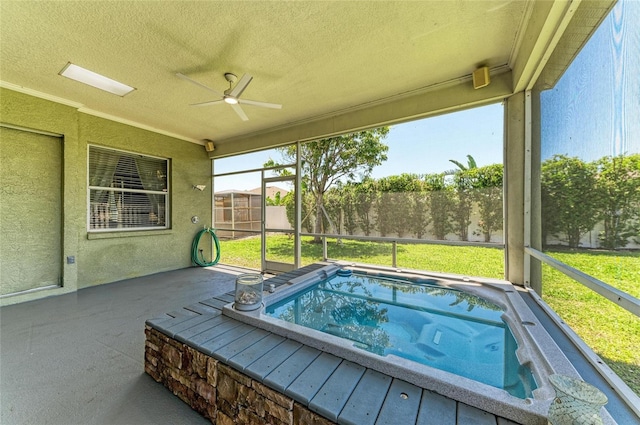 exterior space with ceiling fan and a hot tub