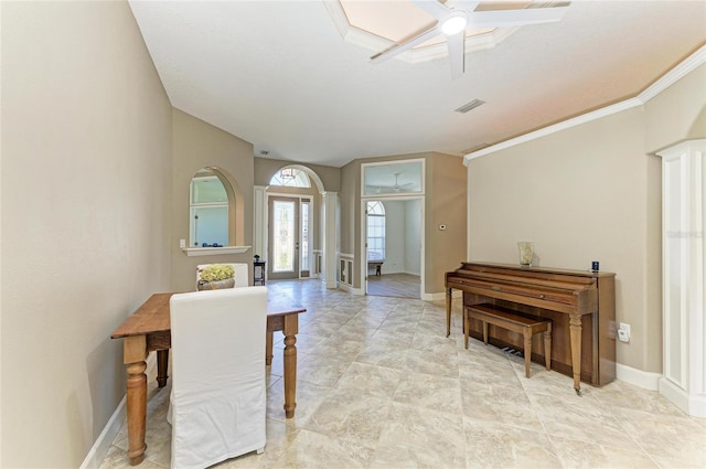 interior space featuring baseboards, visible vents, and ornamental molding