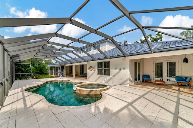rear view of property with stucco siding, french doors, a patio area, a tiled roof, and a pool with connected hot tub