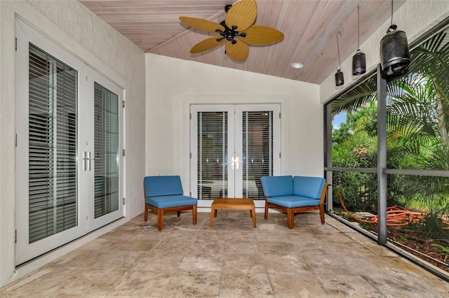 sunroom / solarium with french doors and ceiling fan