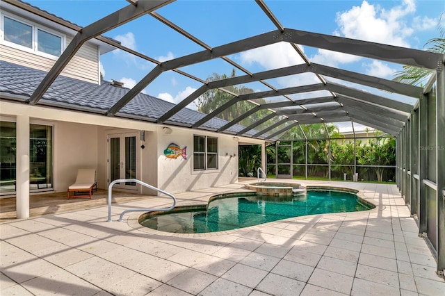 4307 Camino Real, Sarasota, FL 34231 - view of pool with a patio area, a pool with connected hot tub, french doors, and glass enclosure