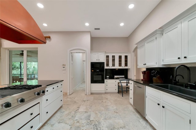 4307 Camino Real, Sarasota, FL 34231 - kitchen with black appliances, a sink, white cabinets, dark countertops, and recessed lighting