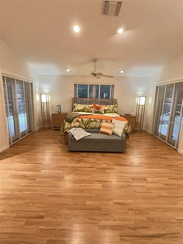 4307 Camino Real, Sarasota, FL 34231 - bedroom with light wood-style floors, baseboards, multiple windows, and recessed lighting