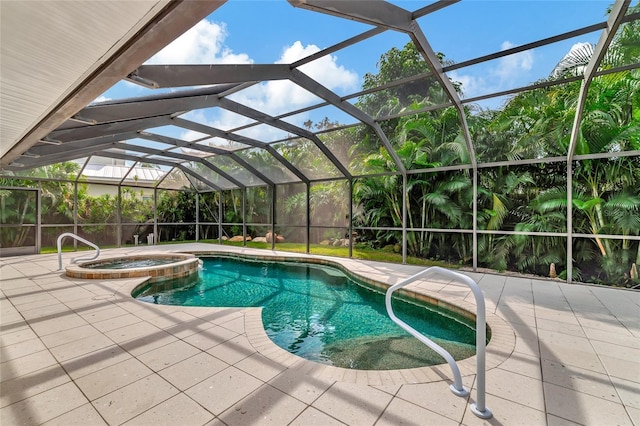 4307 Camino Real, Sarasota, FL 34231 - view of swimming pool featuring a pool with connected hot tub, a patio area, and a lanai