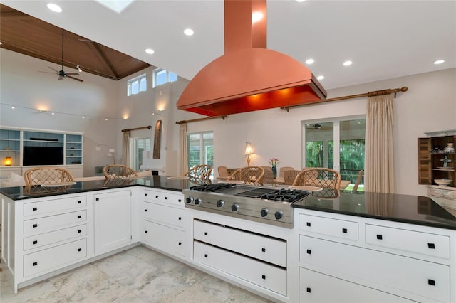 4307 Camino Real, Sarasota, FL 34231 - kitchen with stainless steel gas cooktop, island exhaust hood, ceiling fan, dark countertops, and open floor plan
