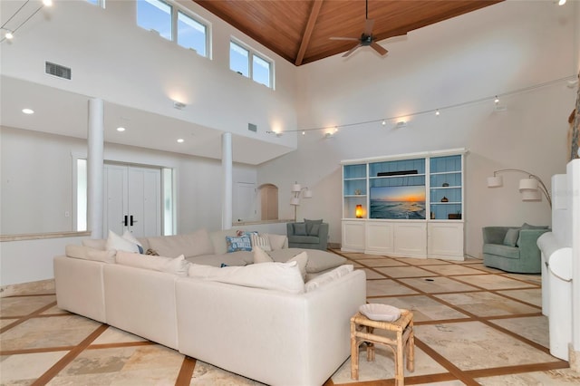 4307 Camino Real, Sarasota, FL 34231 - living area with inlaid floor details, wood ceiling, ceiling fan, a high ceiling, and recessed lighting