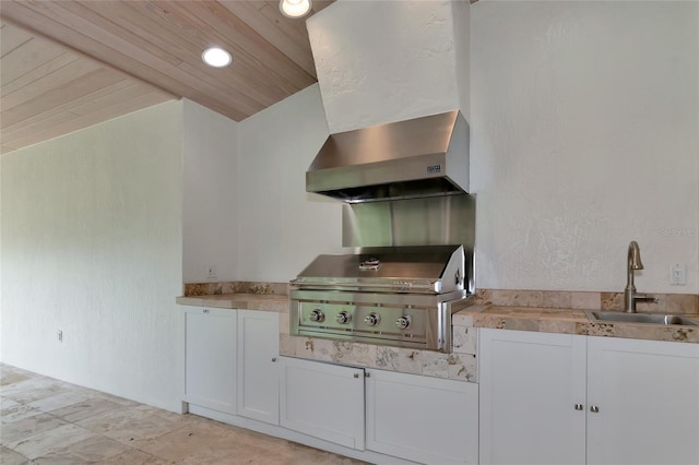 4307 Camino Real, Sarasota, FL 34231 - kitchen with a sink, wall chimney exhaust hood, wood ceiling, white cabinetry, and light countertops