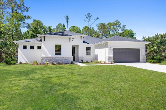 prairie-style home with an attached garage, a front lawn, stone siding, stucco siding, and driveway