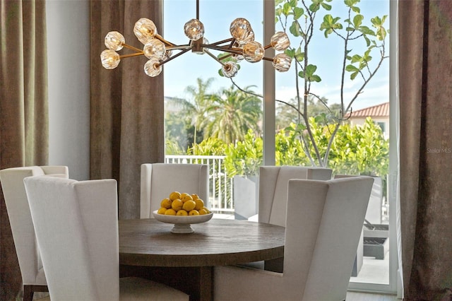 dining area with an inviting chandelier and a healthy amount of sunlight