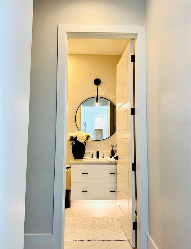 bathroom with vanity and tile patterned floors