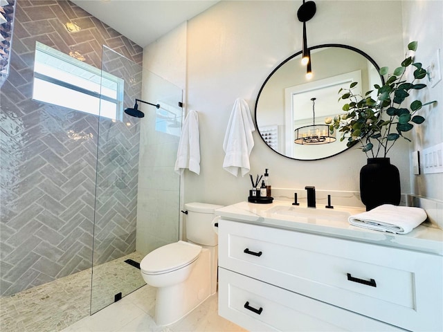 bathroom with vanity, walk in shower, a notable chandelier, and toilet