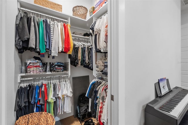 spacious closet featuring wood finished floors and visible vents