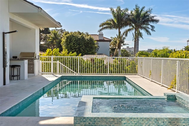 view of pool featuring area for grilling, fence, and a fenced in pool