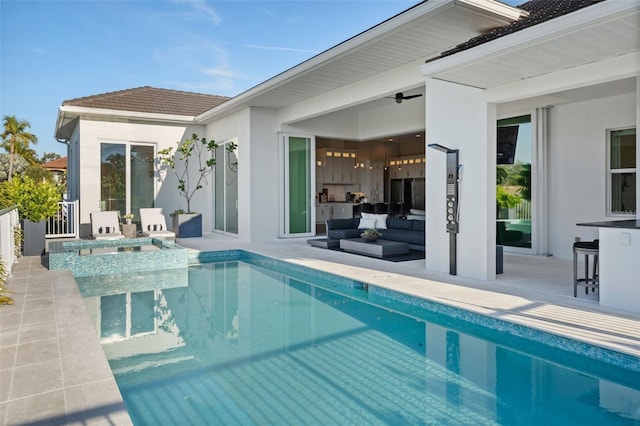 pool with a patio and an outdoor living space