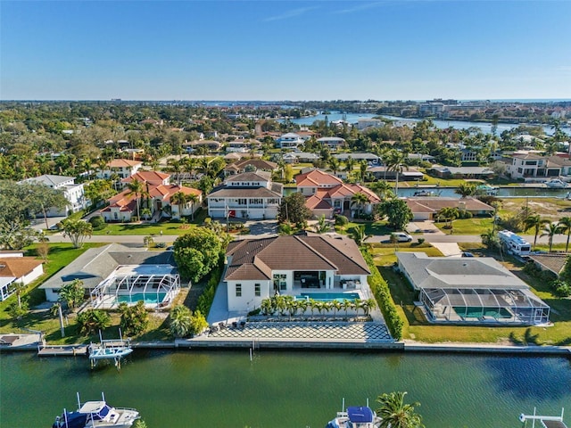 bird's eye view with a residential view and a water view