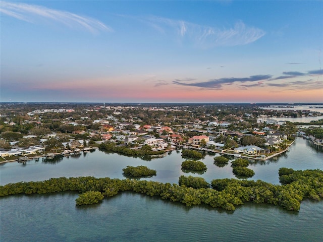 drone / aerial view with a water view and a residential view