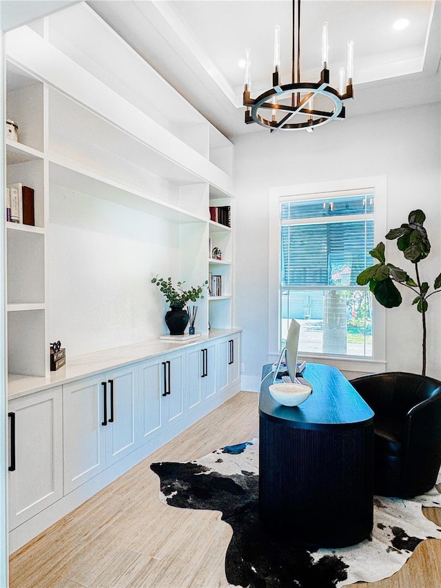 1643 Stanford Ln, Sarasota, FL 34231 - office space with light wood-style flooring, a chandelier, and built in shelves