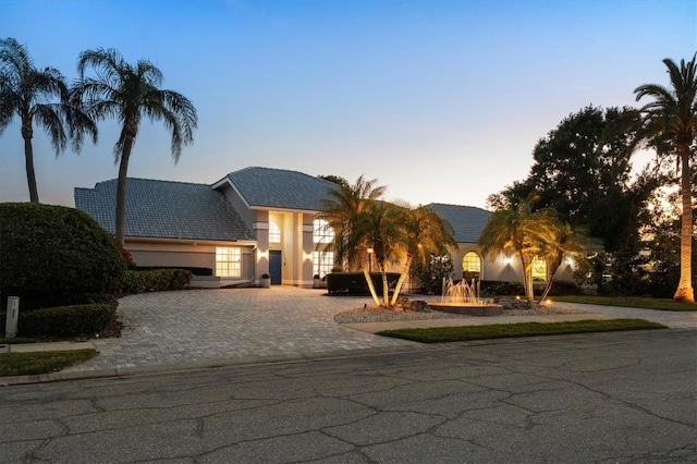 view of front of property with stucco siding and driveway