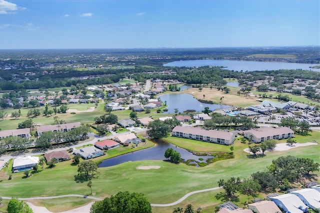 bird's eye view with a water view, view of golf course, and a residential view
