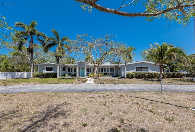 2723 59th St, Sarasota, FL 34243 - ranch-style home with fence and a front lawn