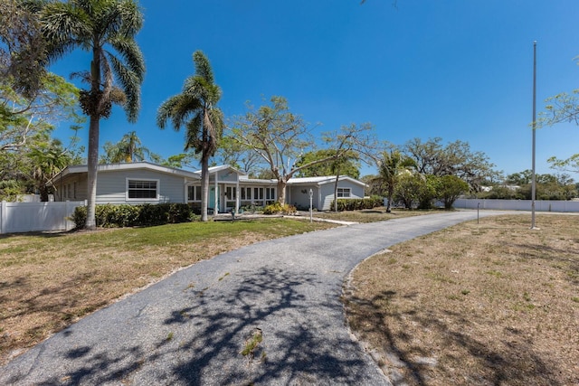 2723 59th St, Sarasota, FL 34243 - single story home with fence, driveway, and a front yard