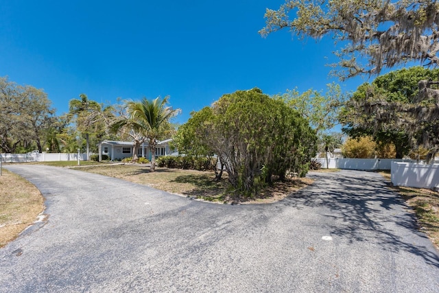 2723 59th St, Sarasota, FL 34243 - view of front of home featuring fence and aphalt driveway