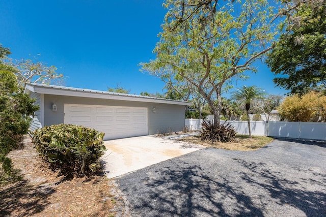 2723 59th St, Sarasota, FL 34243 - garage with fence and driveway