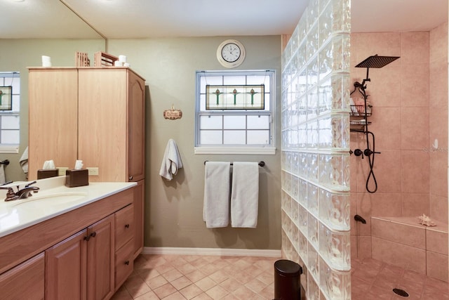 2723 59th St, Sarasota, FL 34243 - bathroom featuring vanity, walk in shower, and tile patterned floors