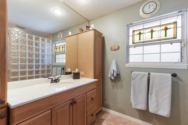 2723 59th St, Sarasota, FL 34243 - bathroom with vanity, baseboards, visible vents, and a wealth of natural light