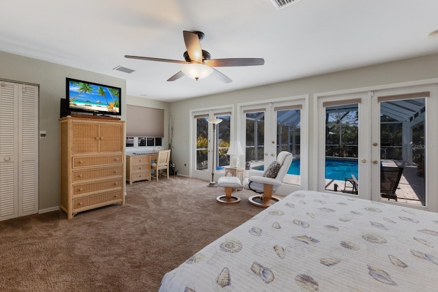 2723 59th St, Sarasota, FL 34243 - bedroom with french doors, carpet, multiple windows, and access to exterior