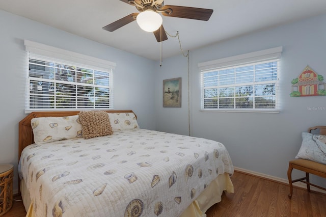 2723 59th St, Sarasota, FL 34243 - bedroom featuring a ceiling fan, baseboards, and wood finished floors