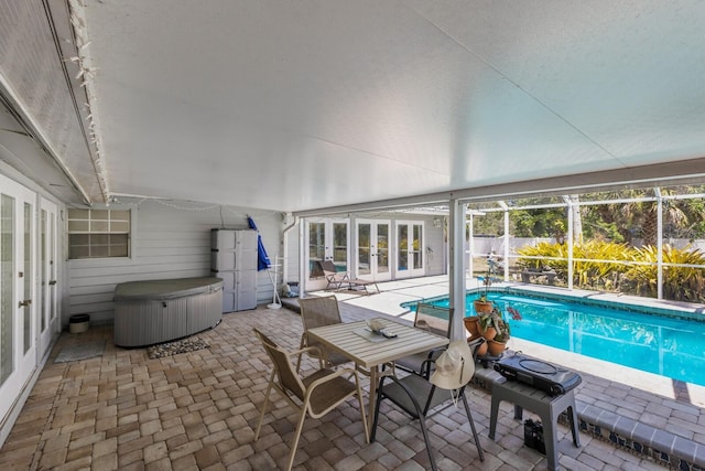 2723 59th St, Sarasota, FL 34243 - view of pool with french doors, a fenced in pool, a patio area, glass enclosure, and a hot tub