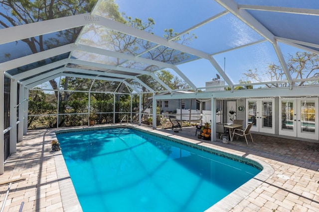 2723 59th St, Sarasota, FL 34243 - pool with french doors, a lanai, and a patio area