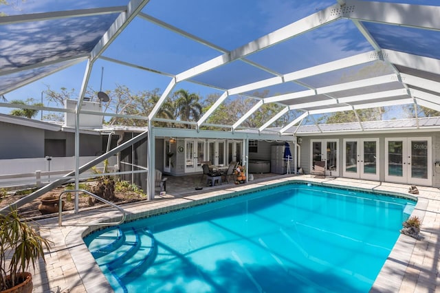 2723 59th St, Sarasota, FL 34243 - pool with glass enclosure, a patio area, and french doors