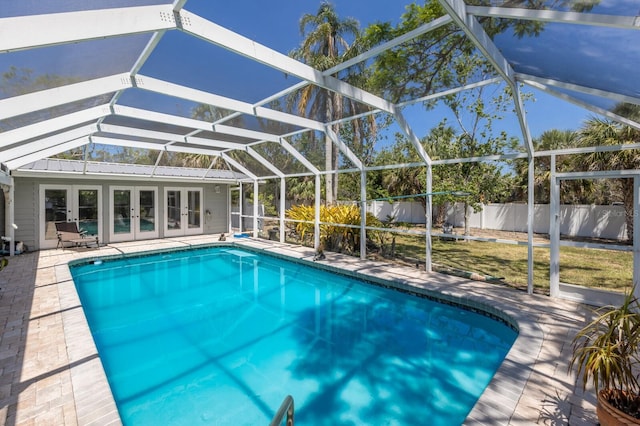 2723 59th St, Sarasota, FL 34243 - view of swimming pool featuring a fenced in pool, glass enclosure, fence, and french doors