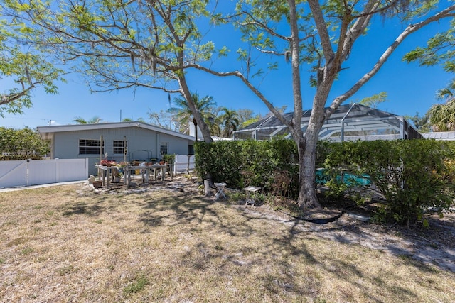 2723 59th St, Sarasota, FL 34243 - view of yard featuring glass enclosure and fence