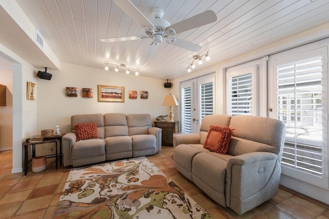 2723 59th St, Sarasota, FL 34243 - living room featuring visible vents, ceiling fan, wooden ceiling, french doors, and rail lighting