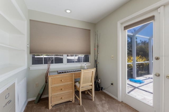 2723 59th St, Sarasota, FL 34243 - carpeted office with baseboards and a healthy amount of sunlight