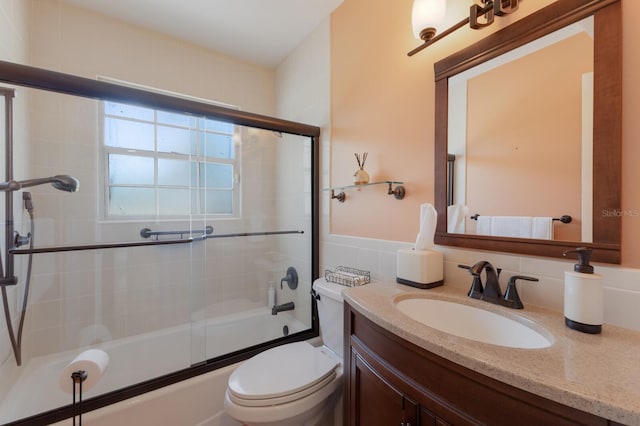 2723 59th St, Sarasota, FL 34243 - full bath with toilet, combined bath / shower with glass door, and vanity