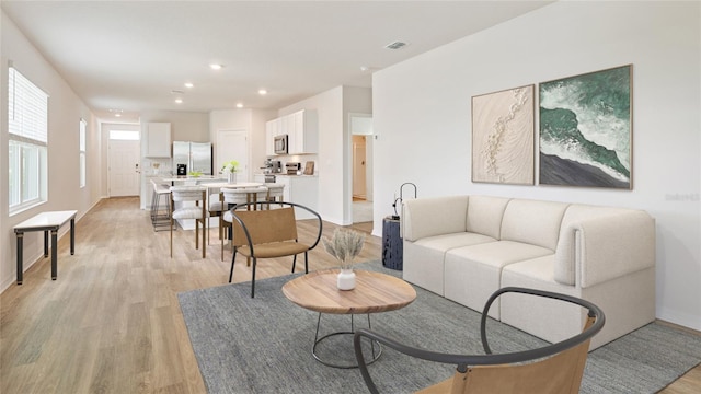 5030 Rocky Coast Pl, Palmetto, FL 34221 - living room featuring recessed lighting, baseboards, visible vents, and light wood-style floors