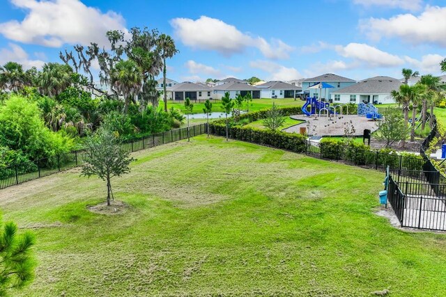 5030 Rocky Coast Pl, Palmetto, FL 34221 - view of yard with fence, a residential view, and playground community