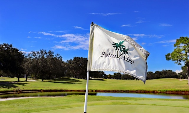 8142 Misty Oaks Blvd, Sarasota, FL 34243 - view of property's community with a water view, golf course view, and a lawn